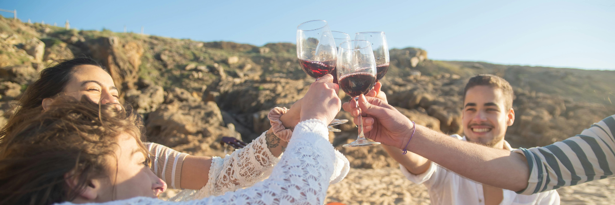 People Drinking On Beach